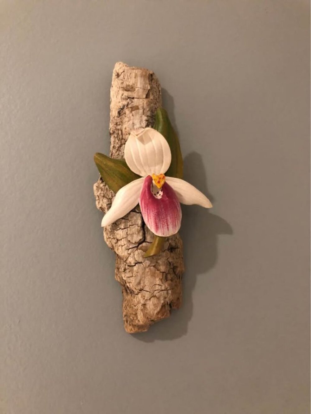 Vintage orchid on driftwood
